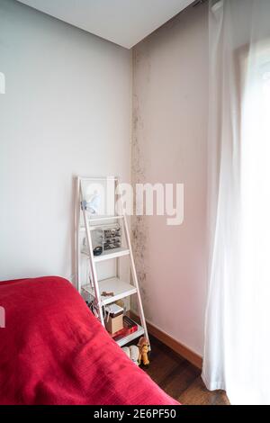 Mold on the edge of a bedroom wall Stock Photo