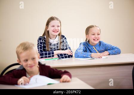 Children are students together in a classroom in school get the education. Stock Photo