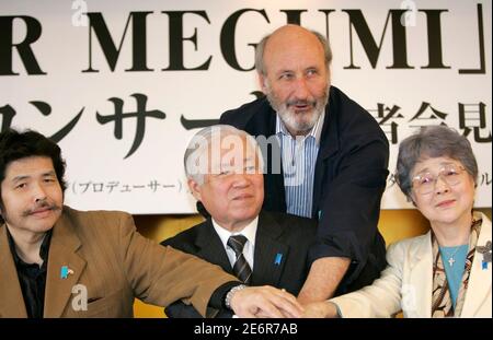 Folk singer Noel Paul Stookey (top) poses with Shigeru Yokota (C) and Sakie Yokota (R), parents of Japanese abductee Megumi Yokota, and music producer Yas Nagai  at a news conference in Tokyo February 19, 2007. Megumi Yokota, who disappeared on her way home from school in 1977 at the age of 13, has become the iconic face of Japanese citizens abducted by Pyongyang's agents to help train spies during the 1970s and 1980s.  REUTERS/Kim Kyung-Hoon (JAPAN)