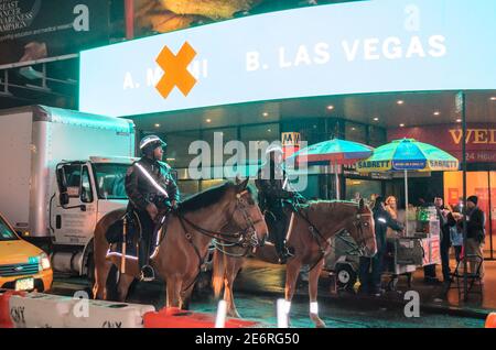 Two Horse Mounted Police Officers Patroling in Times Square, Manhattan, New York City, USA Stock Photo