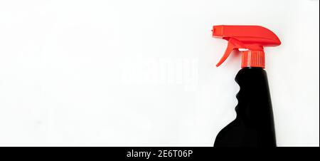 Banner. Concept of cleaning company or household cleaning. Black bottle of household spray on a bulom background with room for text Stock Photo