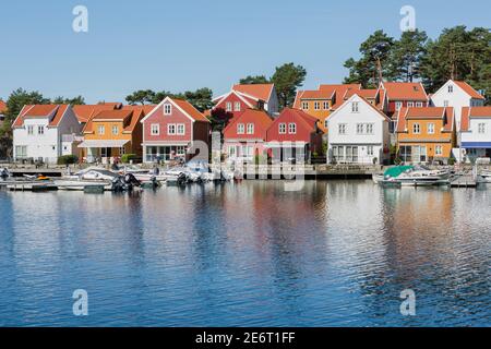 Colorful houses of the beautiful fishing village Svenevig in Southern Norway Stock Photo
