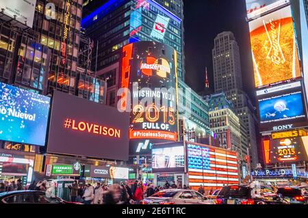 Times Square at Night, Full of Big LED Screens and Bright Lights. Screens Carry Advertisements and Messages. Manhattan, New York City, USA Stock Photo