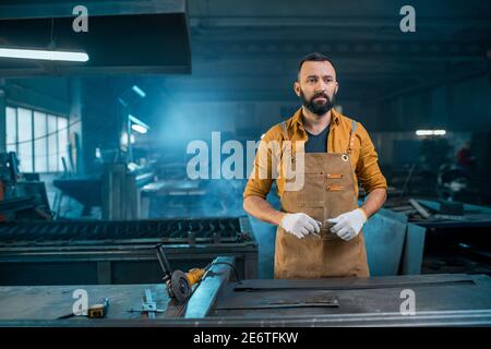 Metal industry worker at factory Stock Photo