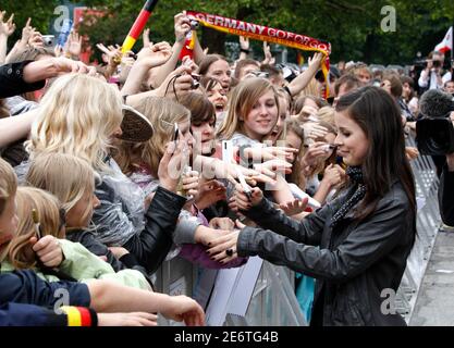 Eurovision winner Lena Meyer-Landrut of Germany signs autographs during a homecoming reception at the city hall in Hanover, May 30, 2010. Germany celebrated its first win in the Eurovision Song Contest in nearly three decades on Sunday with fireworks, street parties and a frenzied revelry normally reserved for World Cup soccer victories. Lena ended Germany's long losing streak in the popular European-wide song competition with an improbable triumph over 24 other finalists in a live programme from Oslo watched by more than 100 million people across Europe.      REUTERS/Tobias Schwarz     (GERMA