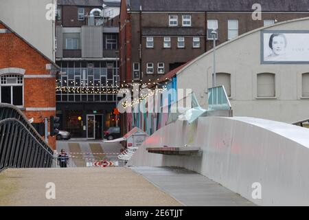 Cork, Ireland. 29th Jan, 2021. Mary Elmes Bridge Closed, Cork City. Mary Elmes Bridge was closed to pedestrians today to facilitate the cleanup and repair of the glass panes that run down the centre of the seating area of the bridge which had been badly damaged. The glass was badly smashed and bent leaving shards of glass on both sides of the bridge. Large amounts of litter could also be seen scattered throughout the bridge. Credit: Damian Coleman/Alamy Live News Stock Photo