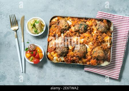 Pasta bake in meatballs and bolognese sauce Stock Photo