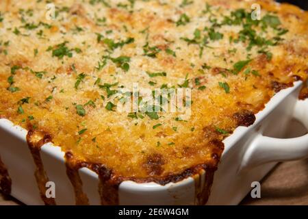 A delicious dish of Mac and Cheese baked in the oven Stock Photo