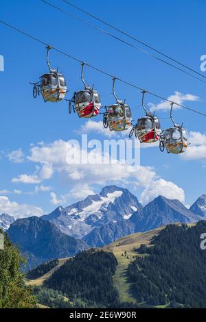 France, Isere, Grandes Rousses massif, T?l?village ski lift between Huez and L'Alpe d'Huez skiresort, Muzelle glacier in the Ecrins National Park in the background Stock Photo