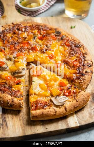 Close up of slice of pizza with bell peppers Stock Photo