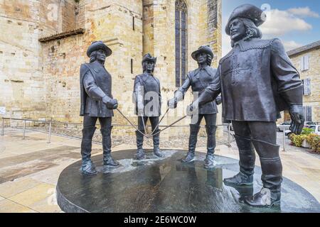 France, Gers, Condom on the Via Podiensis, one of the pilgrim routes to Santiago de Compostela or GR 65 (UNESCO World Heritage site), statue of d'Artagnan and the three musketeers by Georgian sculptor Zurab Tsereteli in St. Peter's Square Stock Photo
