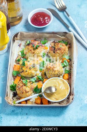 Vegetarian fritters in a baking tray Stock Photo