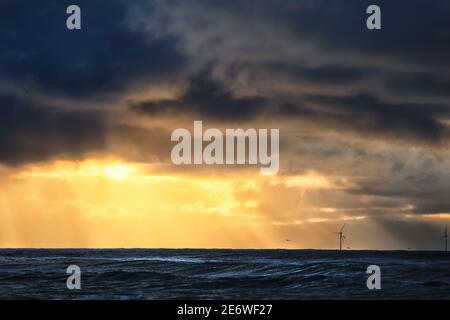 dramatic stormy sunset over sea horizon, Netherlands Stock Photo