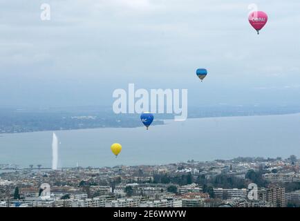 Hot air balloons fly above the city during the third hot air balloons festival in Geneva March 24, 2007.  REUTERS/Denis Balibouse   (SWITZERLAND)
