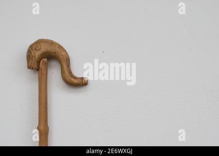 Wooden shepherd's crook head of shepards walking stick on a white background.Traditional greek canes Stock Photo