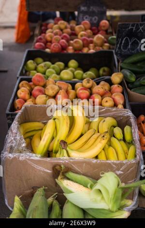Vertical shot of various fruits and vegetables in a market Stock Photo