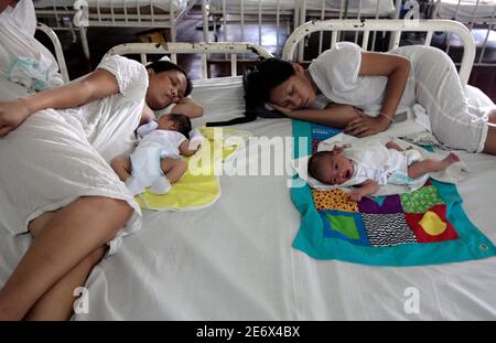 Mothers Rest With Their Newborn Babies Inside A Maternity Ward Of The Government Run Fabella Hospital In Manila April 17 08 The Population Of The Philippines Reached 57 Million At A Census In Mothers Rest With Their Newborn Babies Inside A Maternity Ward Of The Government Run Fabella Hospital In Manila April 17 08 The Population Of The Philippines Reached 57 Million At A Census In