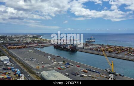 France, Reunion Island, Le Port,Freight port, quayside boat, containers (aerial view) Stock Photo