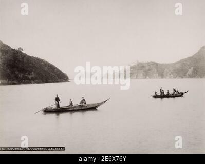 Vintage 19th century photograph: boats in the water at the entrance to Nagasaki harbour, Japan. Stock Photo