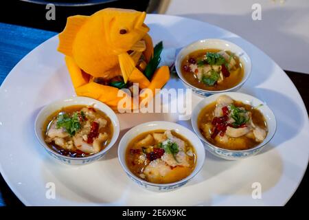 Chinese stew with peppers, tomatoes and zucchini. Chinese soup noodle. Chinese vegetables stew, mixture of white radish Stock Photo