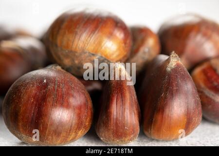 Close up view. Pile of ripe chestnuts. Selective focus. Stock Photo