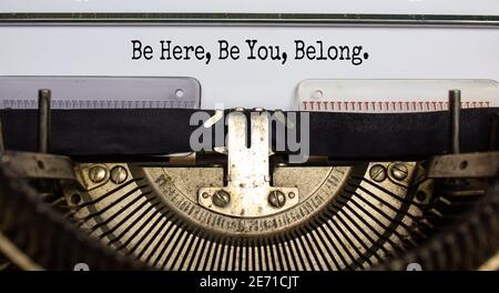 Inclusion and belonging symbol. Words 'be here, be you, belong' typed on retro typewriter. Business, inclusion, belonging and you belong here concept. Stock Photo