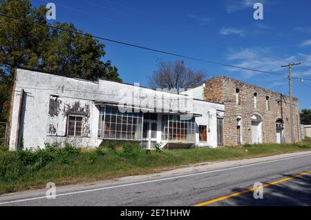 Vacant commercial buildings dating from the early 1900s line old Route 66 through the village of Halltown, Missouri. Stock Photo