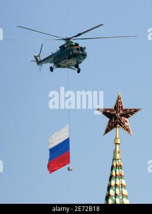 Military helicopter with a Russian state flag flies over Red Square in Moscow during a Victory Day ceremony May 9, 2009. President Dmitry Medvedev warned against 'military adventurism' on Saturday, saying Russia would firmly defend its interests -- just as it did during World War Two when the Soviet Union defeated fascism. Medvedev, opening the biggest and most spectacular Victory Day parade in modern Russia's history, clearly aimed his warning at post-Soviet neighbour Georgia which Russia defeated in a five-day war last August.  REUTERS/Alexander Natruskin  (RUSSIA MILITARY POLITICS ANNIVERSA