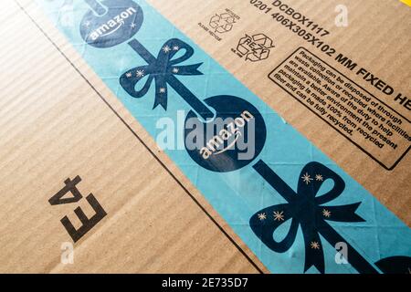 Paris, France - Nov 16, 2018: Amazon Prime holiday logotype on the scotch tape of delivered parcel from the worldwide online e-commerce warehouse Stock Photo