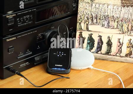 Old vinyl record music technology connects to Google Home smart speakers via bluetooth transceiver. Nostalgia modernisation employing new technology Stock Photo