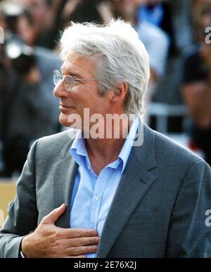 Actor Richard Gere greets fans as he arrives for the premiere of his new  comedy film 