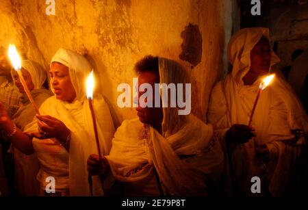 Ethiopian Orthodox worshippers take part in the Holy Fire ceremony at the Ethiopian section in the Church of the Holy Sepulchre in Jerusalem's Old City April 26, 2008. REUTERS/Baz Ratner (JERUSALEM)