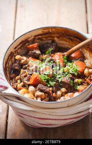 Boeuf bourguignon with carrots, mushrooms, topped with parsley Stock Photo