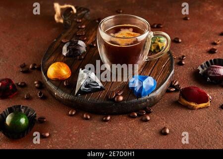 Chocolates in the form of precious stones with cup of espresso coffee. Gift for St. Valentine. Stock Photo