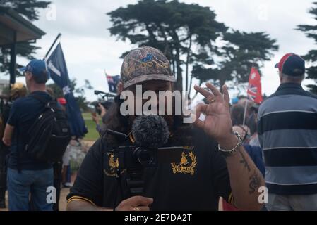 A Proud Boy flashes the white supremacy 'W' hand sign. 26 January 2021, Melbourne, Australia. Credit: Jay Kogler/Alamy Live News Stock Photo