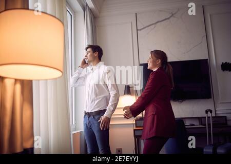 Young couple preparing for a business meeting together; Business lifestyle concept Stock Photo