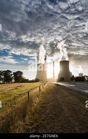 Smokestacks and cooling towers of coal fired power plants. Stock Photo