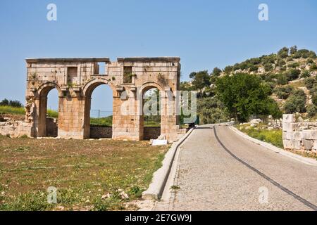 Ruins of city gate near the road to arheological site of ancient Lycian city of Patara, Lycia, Turkey Stock Photo