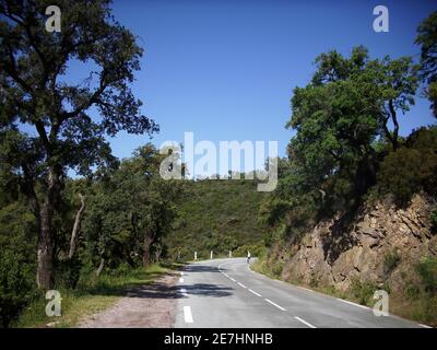 Road leading through the mountains in the south of France between Saint Tropez and Nice. Stock Photo