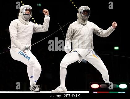 Italy's Montano (L) and Dmytro Boyko of Ukraine compete in the men's fencing team sabre final at the European Fencing Championship in Leipzig, July 20, 2010. REUTERS/Alex Domanski (GERMANY - Tags: