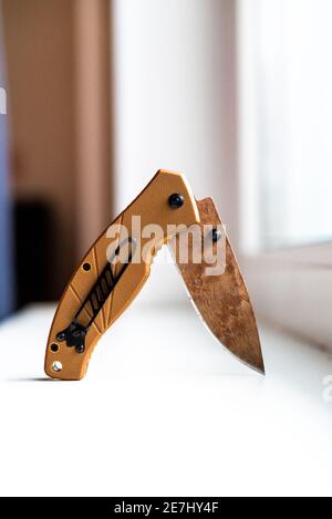 folding hunting knife on a white background Stock Photo