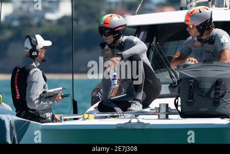 Auckland, New Zealand, 30 January, 2021 -  Italian team Luna Rossa Prada Pirelli team coach i coach Philippe Presti speaks with joint helm Jimmy Spithill (center) between semi-final races with the  New York Yacht Club American Magic team on Patriot, skippered by Terry Hutchinson and helmed by Dean Barker on the Waitemata Harbour of Auckland. The Italian team won the semi-finals 4-0 and will meet INEOS Team UK in the Prada Cup final starting February 12. Credit: Rob Taggart/Alamy Live News Stock Photo