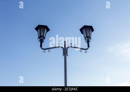 Double lamp post in the town of Albisano in the province of Verona. Stock Photo