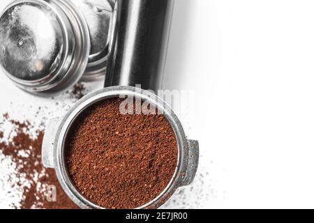 Espresso holder and replaceable coffee filters. The horn from the coffee machine on a white  Stock Photo