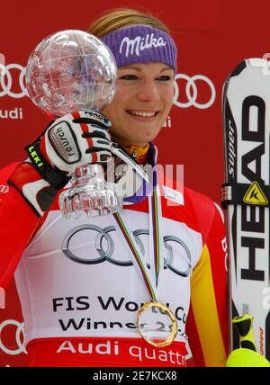 Maria Riesch of Germany poses with the women's Slalom Alpine Skiing World Cup trophy at the season's finals in Garmisch-Partenkirchen March 13, 2010.    REUTERS/Wolfgang Rattay   (GERMANY SPORT SKIING)