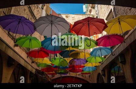 A picture of a bunch of colorful umbrellas on display in Split. Stock Photo