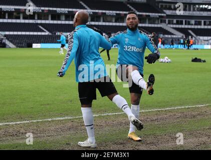 Derby County's Andre Wisdom (left) and Colin Kazim-Richards warming up before the Sky Bet Championship match at Pride Park Stadium, Derby. Picture date: Saturday January 30, 2021. Stock Photo