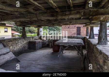 Unique house supported by vertical large stones and open on the sides Stock Photo