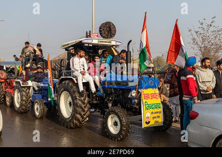 huge number of tractor with indian flag going for tractor rally during farmers protest at tikri border,delhi, india. Stock Photo