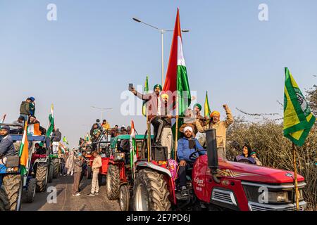 huge number of tractor with indian flag going for tractor rally during farmers protest at tikri border,delhi, india. Stock Photo